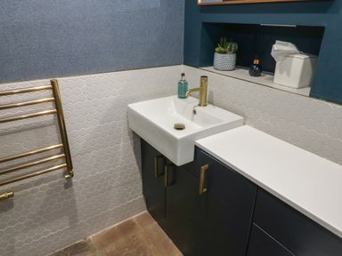 A bathroom with a sink and towel warmer at Chapel Hill, Catlowdy