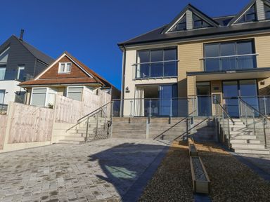 A house with stairs and outdoor area at Seafern House 36B Poole