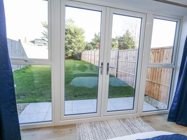 A view of a garden from the bedroom window at Seafern House 36B in Poole