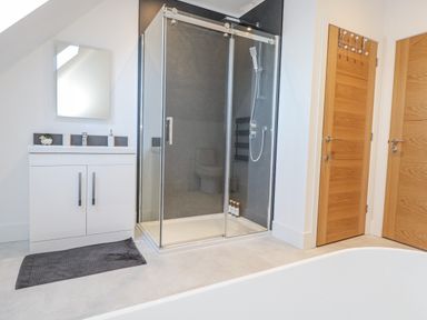 A bathroom with a shower and sink at Seafern House 36B in Poole