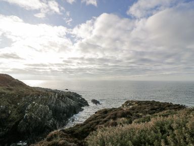 A coastal view with rocks and water at Peaceful in Stranraer