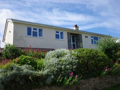 A house with garden and flowers at Badgers Cliff in Polzeath