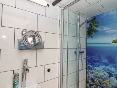 A bathroom with shower and sink at The Bus on the Hill