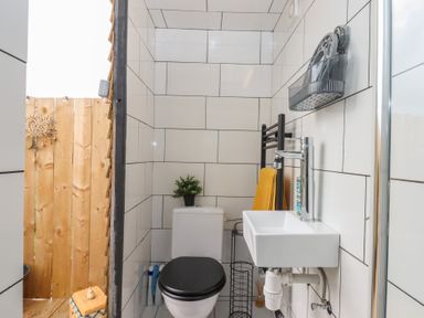 A bathroom with toilet and sink at The Bus on the Hill 