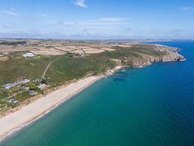 An aerial view of a beach and coastline at The Nook in Praa Sands