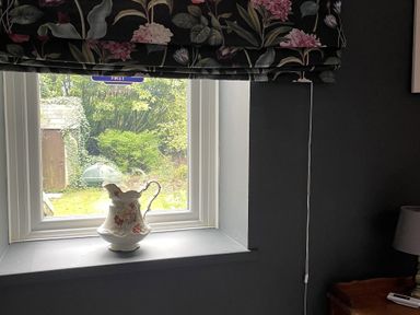 A window with a vase on the sill at High Dyke Cottage