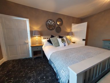 A bedroom with a bed and bedside table at ASH HOUSE in Wincanton
