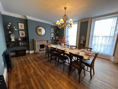 A dining room with a table set at ASH HOUSE Wincanton