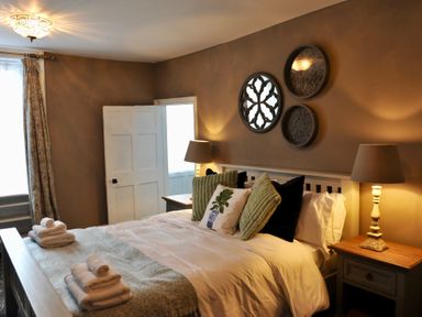 A bedroom with a bed and bedside tables at ASH HOUSE Wincanton