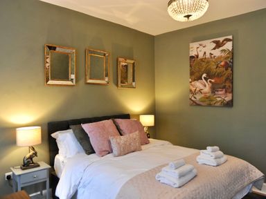 A bedroom with a bed and lamps at ASH HOUSE Wincanton