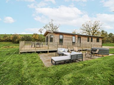 An outdoor patio area with seating at Willow Lodge in Admaston near Abbots Bromley