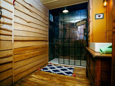 A bathroom with a shower and sink at the property