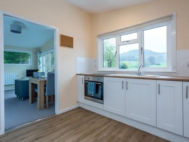 A kitchen with an oven and sink at the property in the countryside