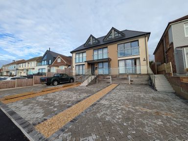A house with balconies and driveway at Sea Fern House - 36 Poole