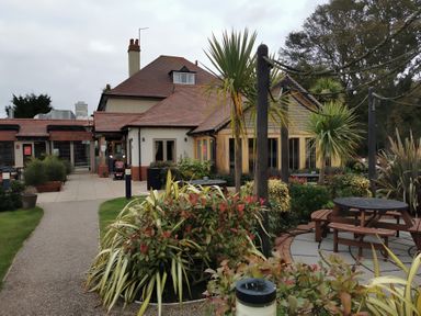 An outdoor area with tables and plants at 311 in Bridlington