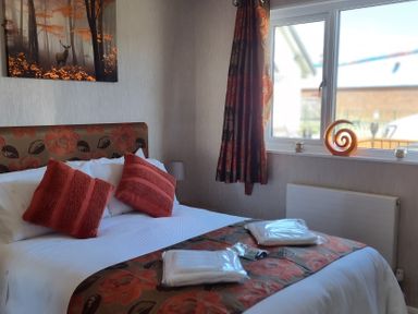 A bedroom with a bed and window at 50 Bridlington