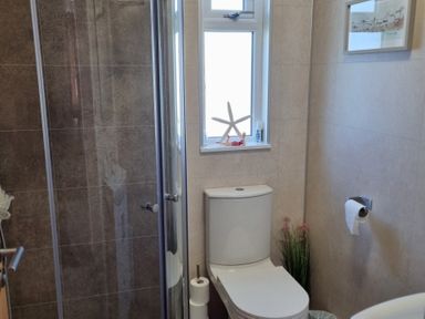 A bathroom with a shower and a toilet at 50 Bridlington