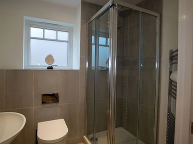 A bathroom with a shower and sink at The Galloway in Morpeth