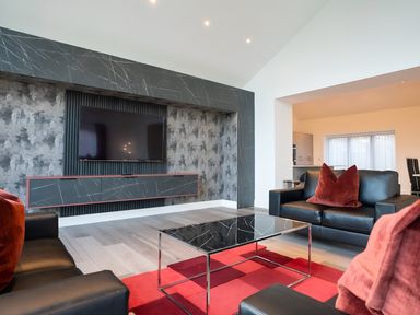 A living room with a television and coffee table at The Shearling in Morpeth
