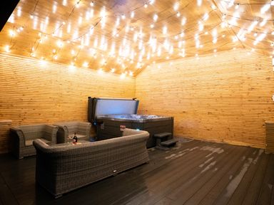 An outdoor area with a hot tub and outdoor furniture at The Shearling in Morpeth