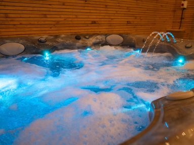 A hot tub with bubbling water and LED lights at The Shearling in Morpeth