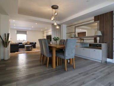 A dining room with a table and chairs at The Newland in Morpeth