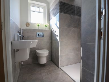 A bathroom with a sink toilet and shower at The Newland in Morpeth