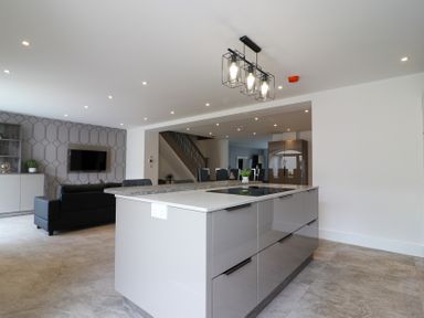 A kitchen with a central island and seating area at The Gavel in Morpeth
