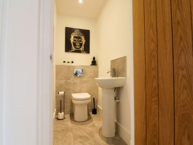 A bathroom with a toilet and sink at The Gavel in Morpeth