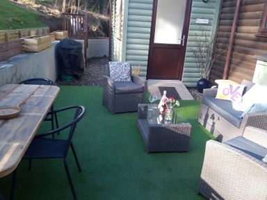 An outdoor area with a table and chairs at Gowrie Lodge in Blairgowrie