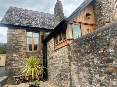 An exterior view of a stone house with a plant in front at 4 Bickington Road Barnstaple