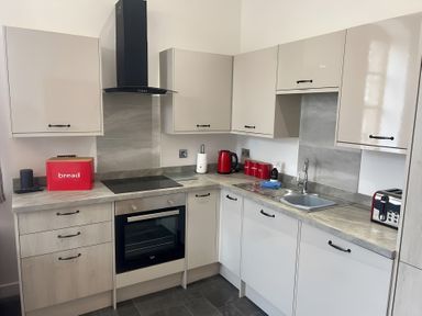 A kitchen with cabinets, countertop, sink, and appliances at 4 Bickington Road, Barnstaple