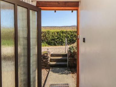 An entrance with a view of the garden at Tullythwaite Barn Kendal