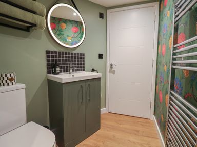 A bathroom with sink and toilet at Unit 1 Ipswich