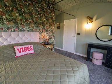 A bedroom with a bed and decorative items at Unit 1 in Ipswich