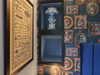 A decorative shelf with a figurine in a room at Unit 2 Ipswich