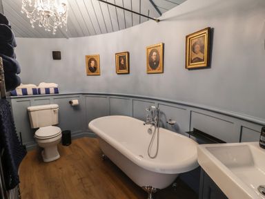 A bathroom with a bathtub and sink at Unit 2 in Ipswich