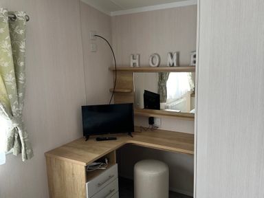 An office with a desk and television at TW89 in Exmouth