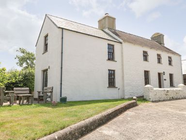 A house with outdoor seating area at Ty Fferm in Newport