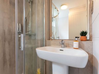 A bathroom with a sink and shower at The Falls Leyburn