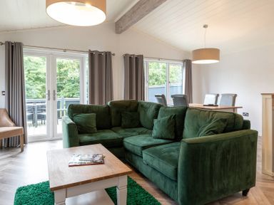 A living room with a green sofa and coffee table at Wensleydale (Pet) Aysgarth