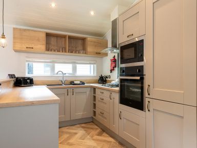 A kitchen with appliances and cabinets at Wensleydale (Pet) Aysgarth