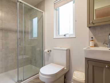 A bathroom with shower, toilet, and sink at Wensleydale (Pet) Aysgarth