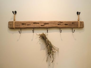 A hook rack with dried herbs hanging at Fairview in Darsham
