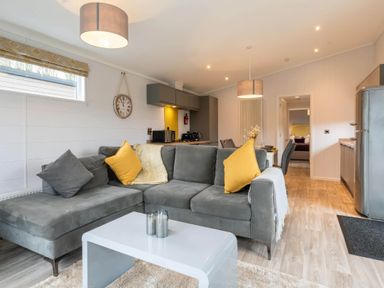 A living room with a sofa and coffee table at The Falls (Pet) Leyburn