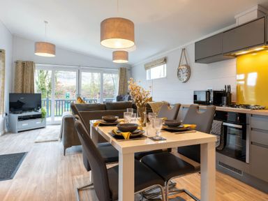 A dining room with a table and chairs at The Falls (Pet) Leyburn