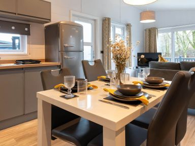 A dining room with a table set at The Falls (Pet) in Leyburn