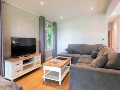 A living room with a television and a coffee table at Bainbridge in Leyburn