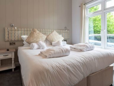 A bedroom with a bed and window at Bainbridge in Leyburn