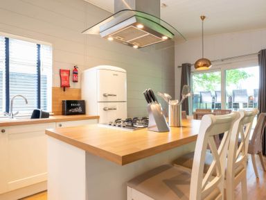 A kitchen with a sink and fridge at Bainbridge (Pet) Leyburn